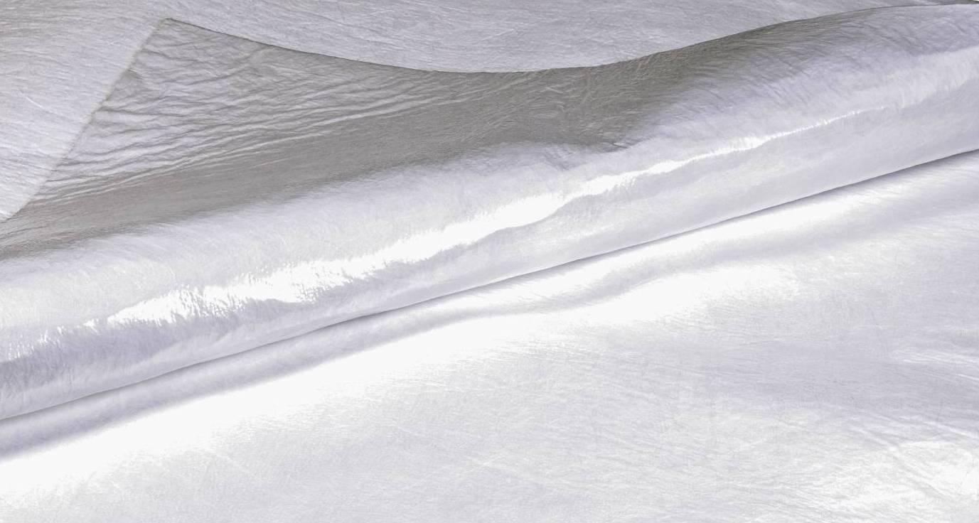 Roll of shiny white satin fabric